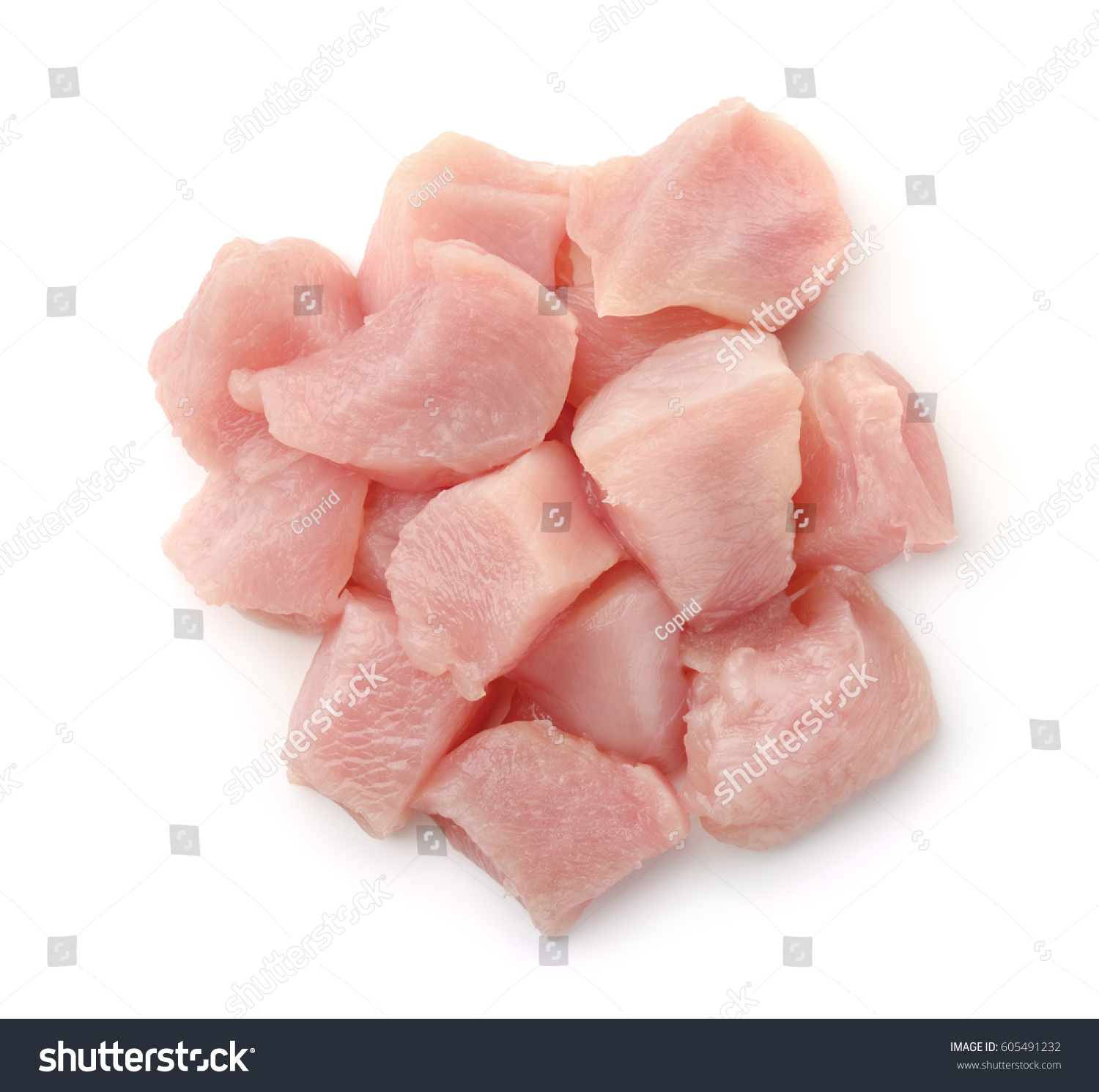 Top view of raw chicken fillet chunks isolated on white #605491232