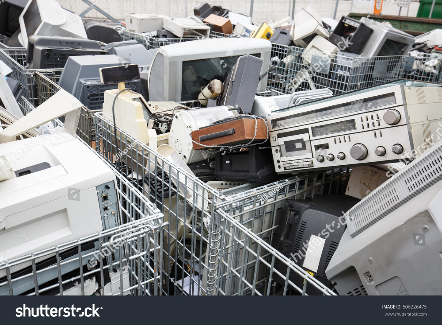 Electronic devices dump site. E-waste disposal, management, reuse, recycle and recovery concept. Electronic consumerism, globalization, raw material source concept. 
 #606226475