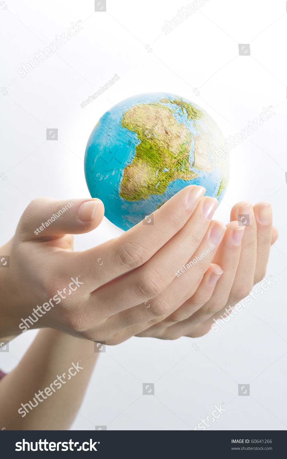 Female hands palms up on white background save the globe from falling. #60641266