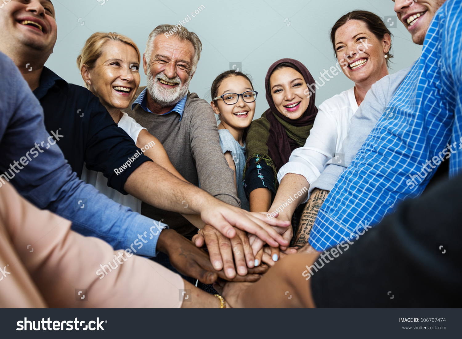 Group of Diverse People Hands Together Teamwork Cooperation #606707474
