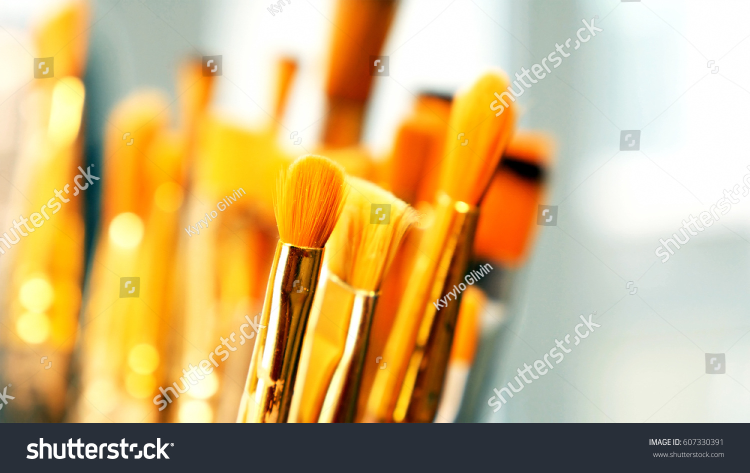 Artist paintbrushes. Set of different artist paint brushes in old crock close-up. Art studio concept. Selective focus footage with shallow DOF. #607330391
