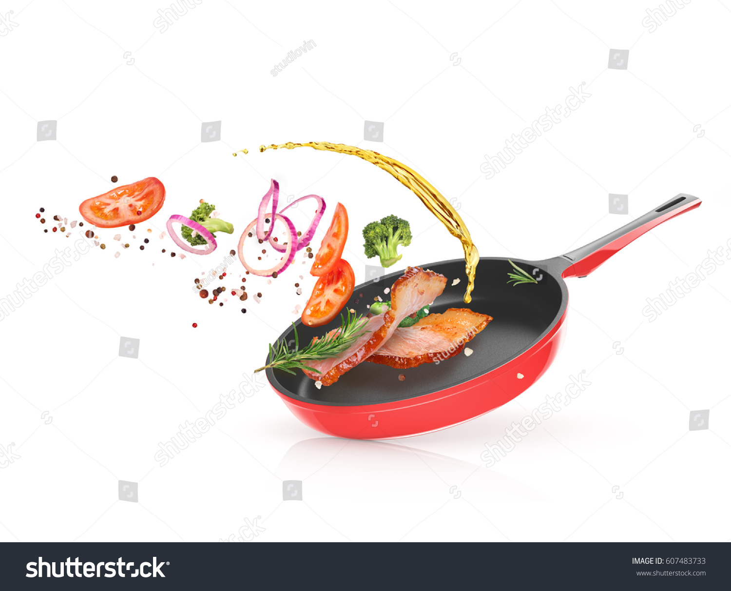 Meat with vegetables in a frying pan #607483733