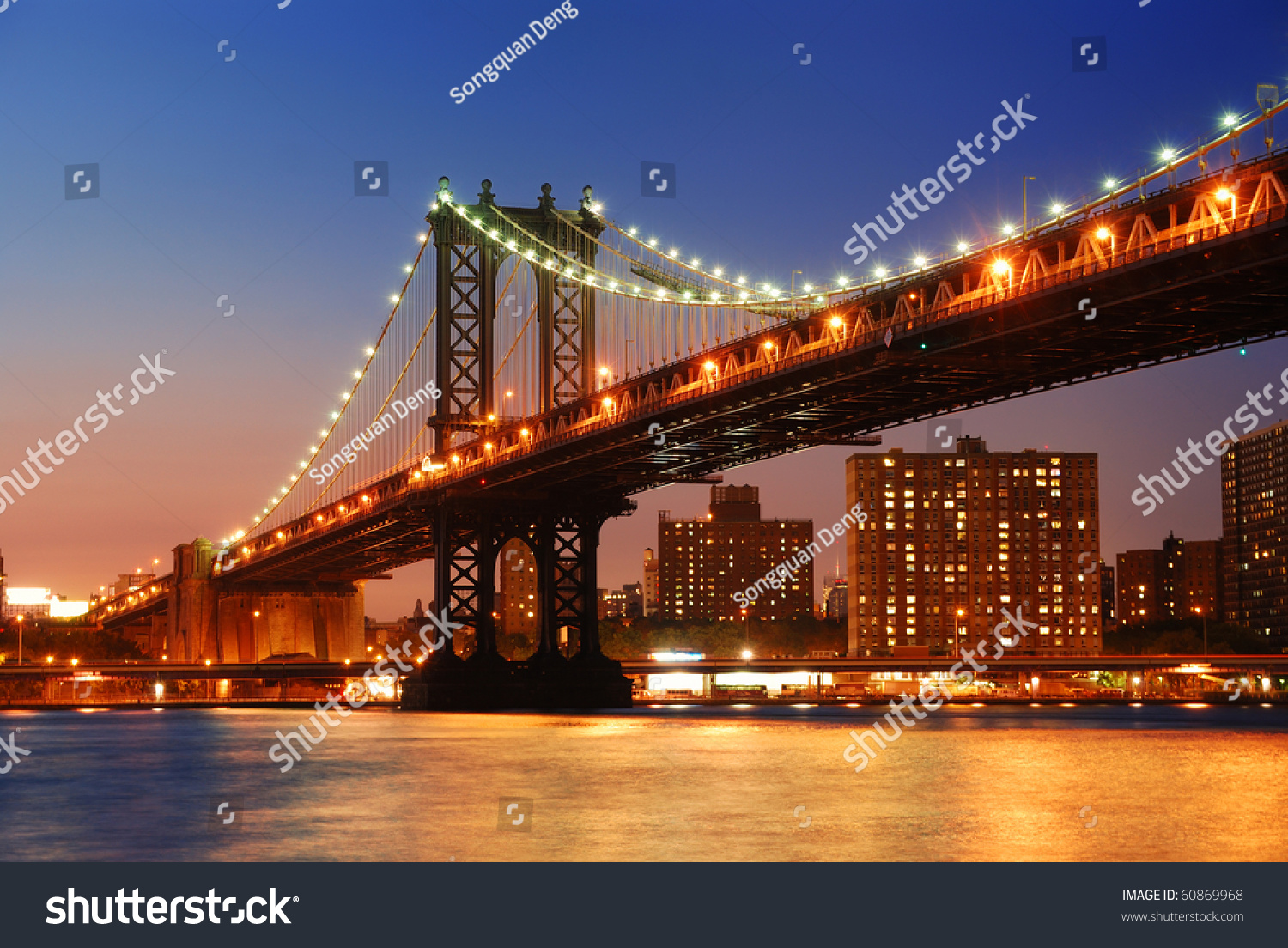 New York City Manhattan Bridge over Hudson River with skyline after sunset night view illuminated with lights viewed from Brooklyn. #60869968