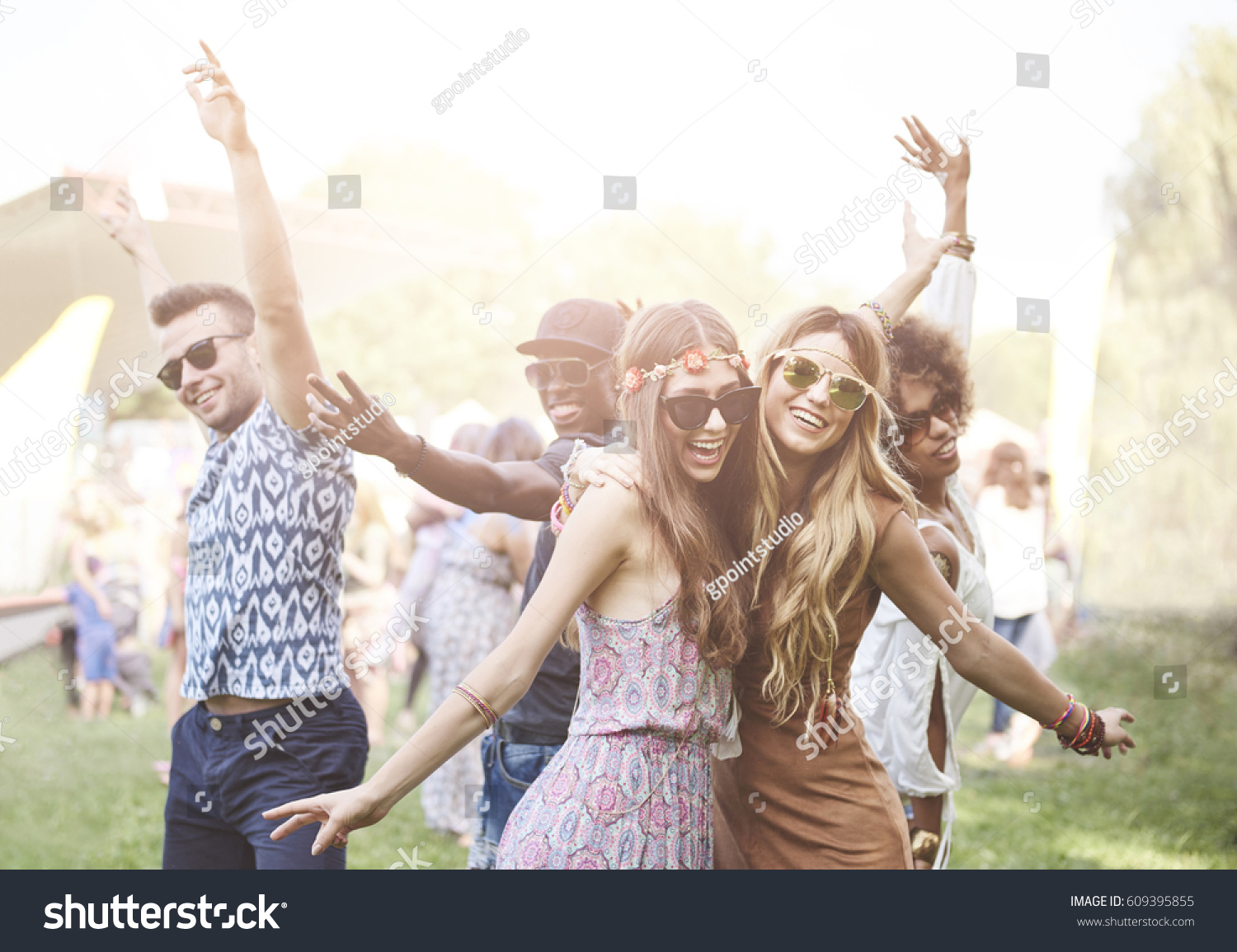 Enthusiastic crowd surfing at music festival  #609395855