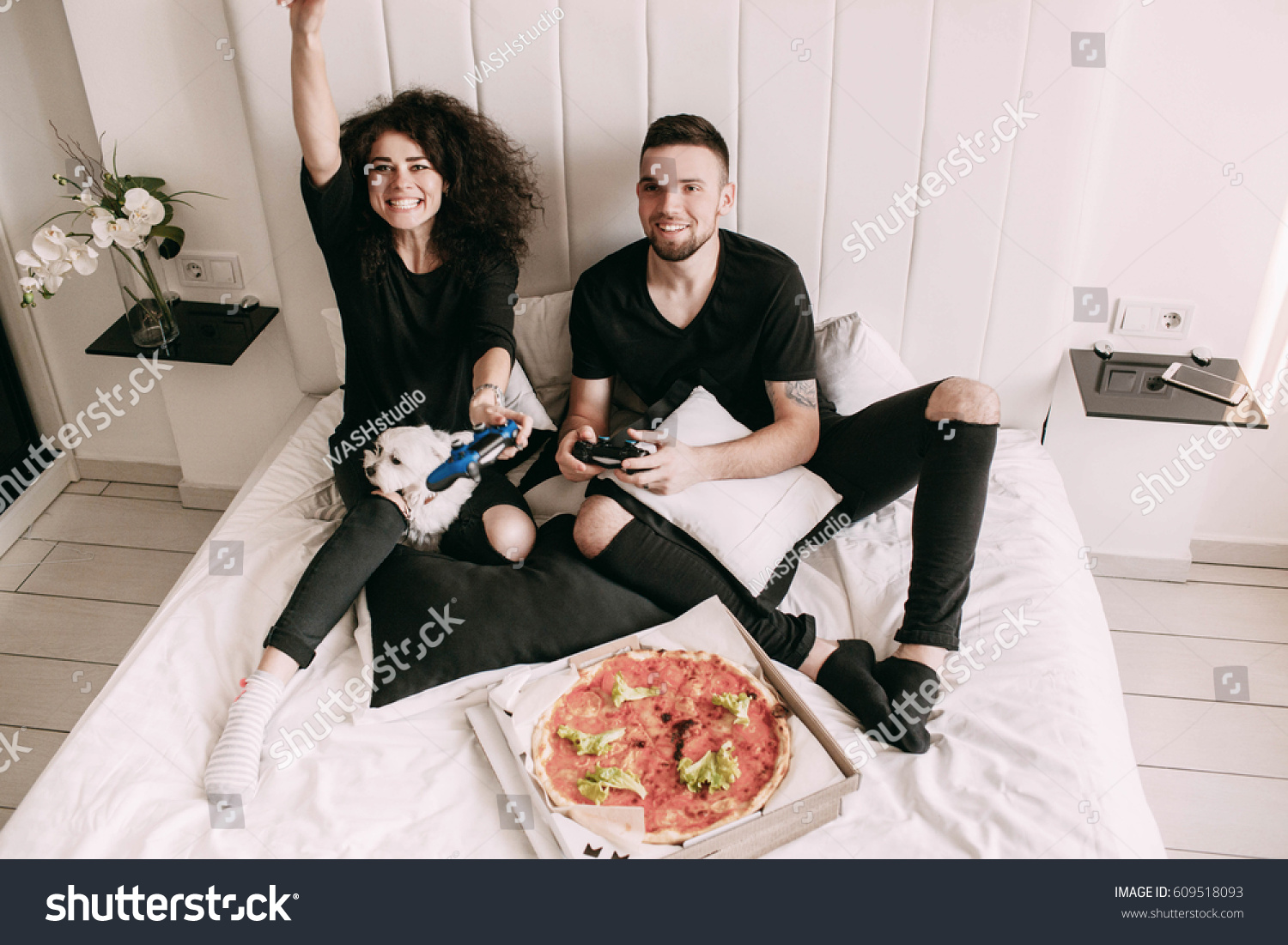 Girl wins playing with man on PS on bed #609518093