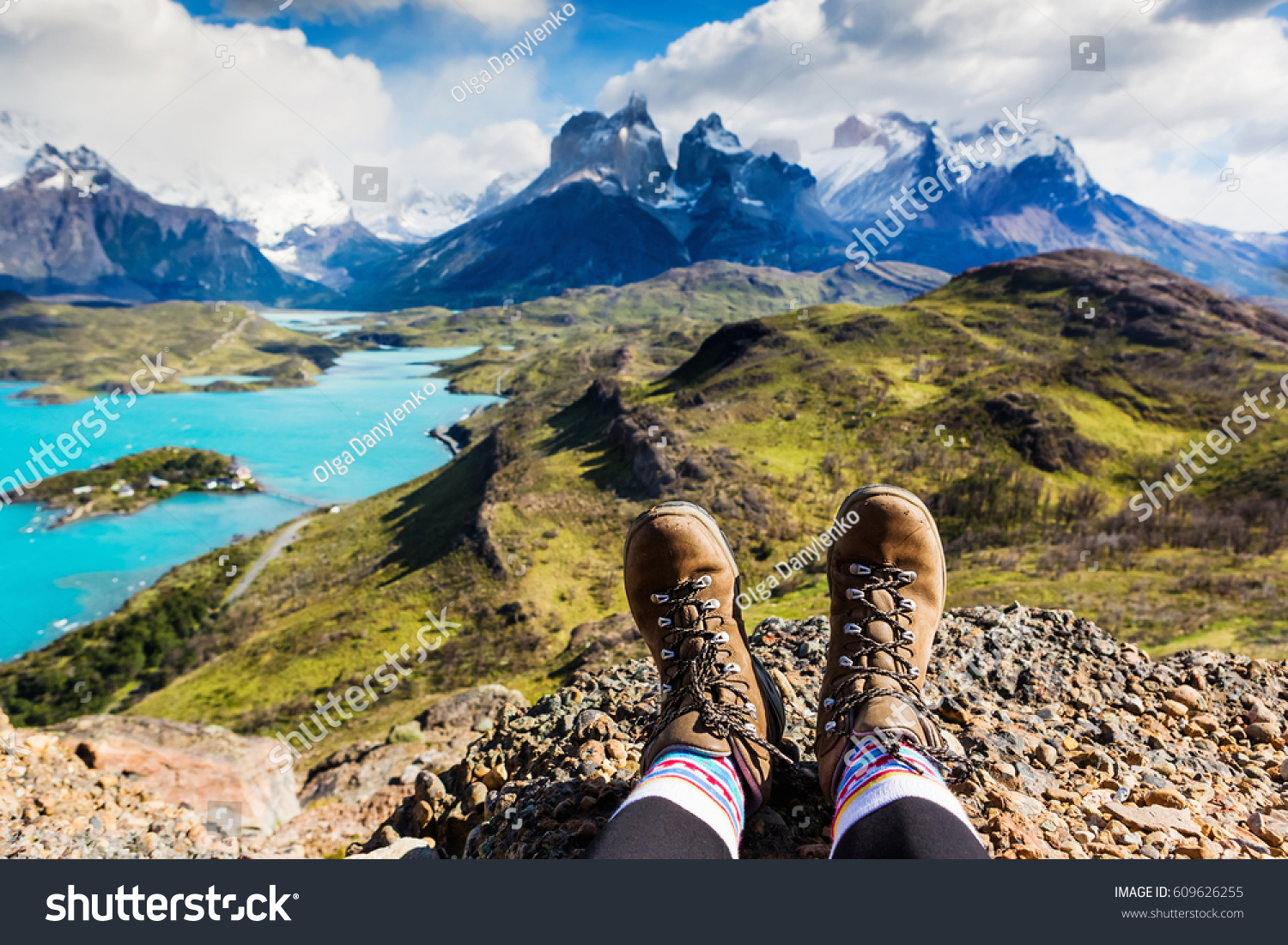 Girl hiking boots having fun and enjoying wonderful breathtaking mountain view. Freedom concept. Los Cuernos rocks, Patagonia, Chile #609626255