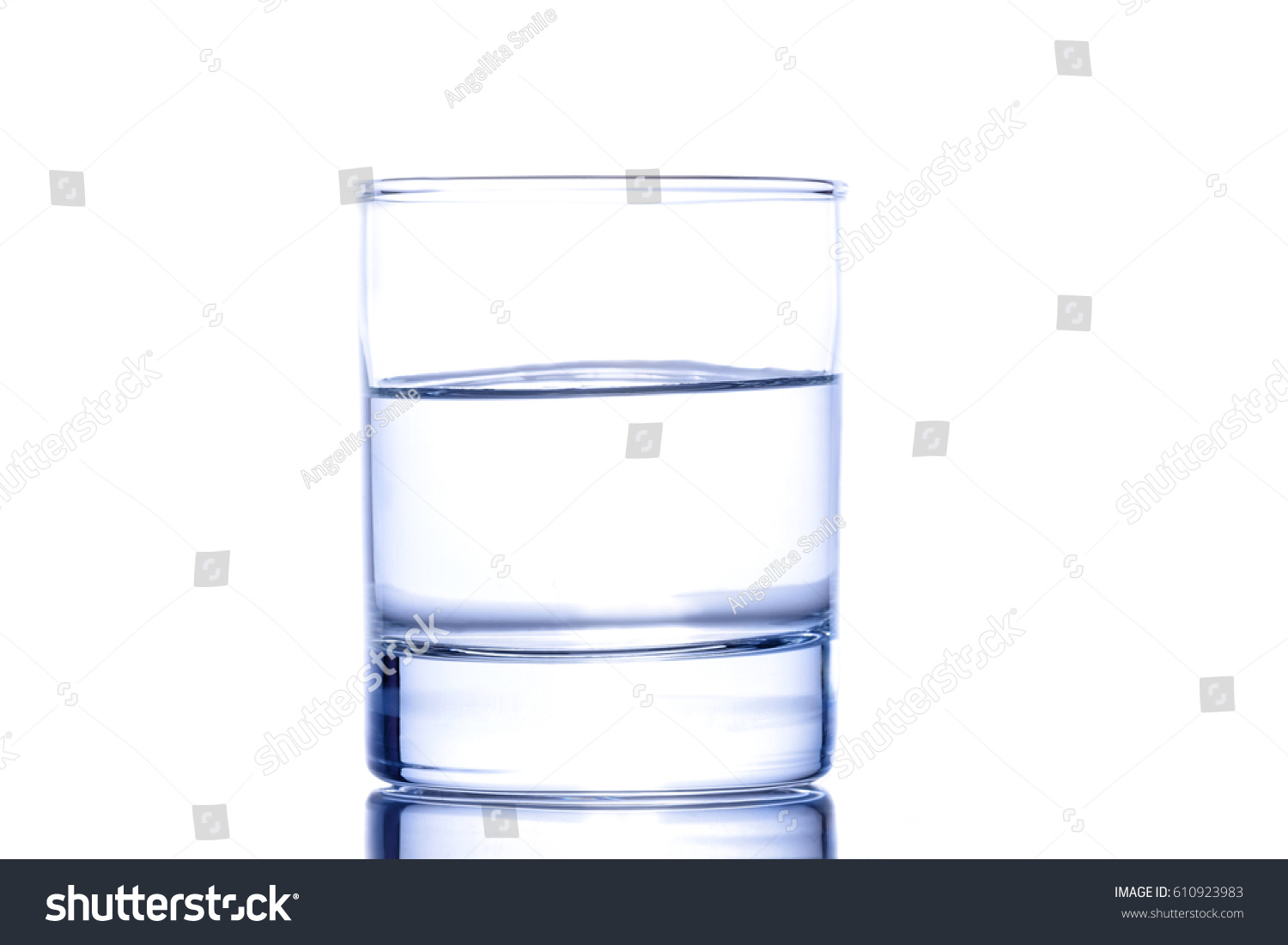 Half a glass of blue water on a white background #610923983