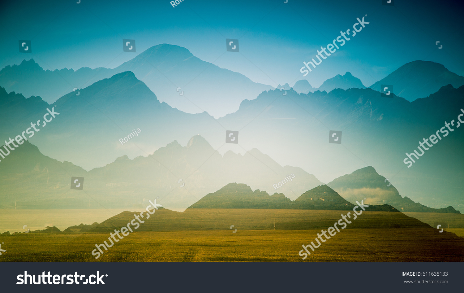 A beautiful, colorful, abstract mountain landscape with a hot summer haze in warm green tonality. Decorative, artistic double exposure. #611635133