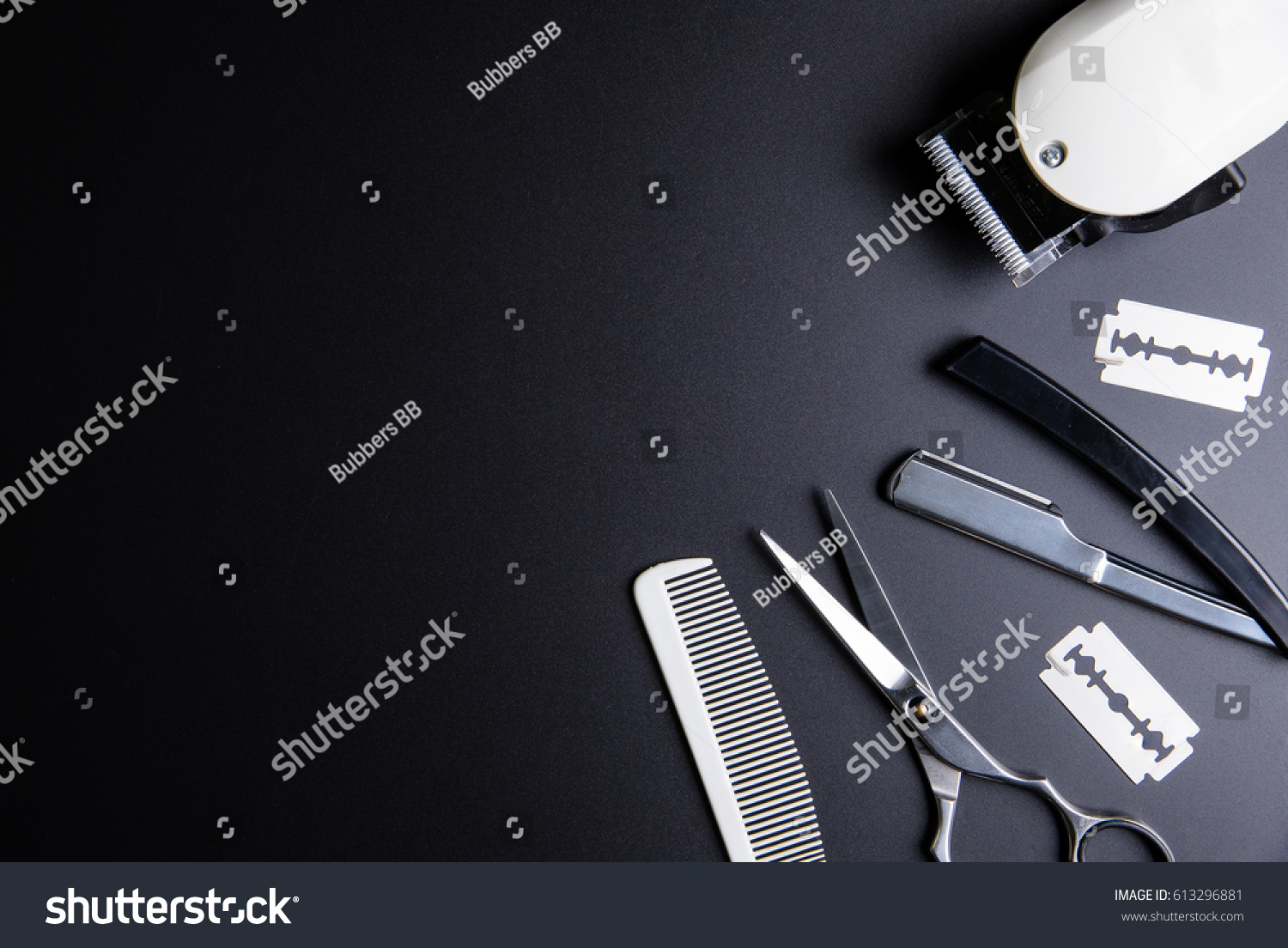 Razor, Stylish Professional Barber Scissors, White comb and White electric clippers on black background. Hairdresser salon concept, Hairdressing Set. Haircut accessories. Copy space image, flat lay #613296881