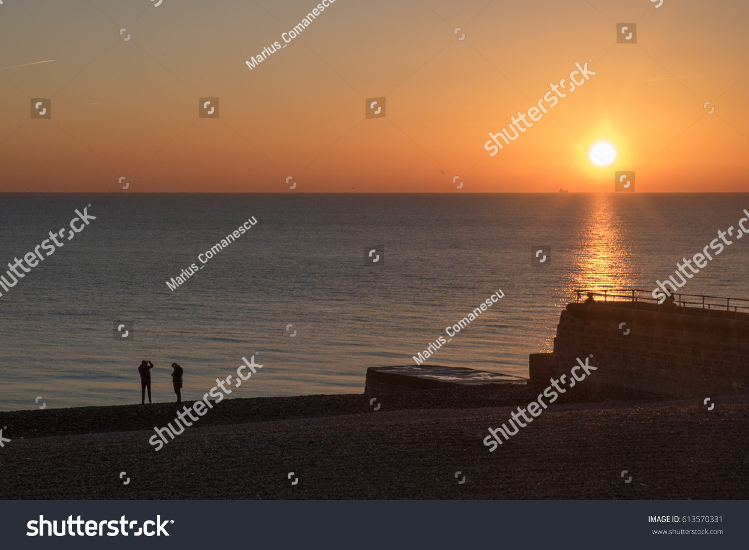 12/01/2016 Brighton, UK. Brighton beach at sunset #613570331