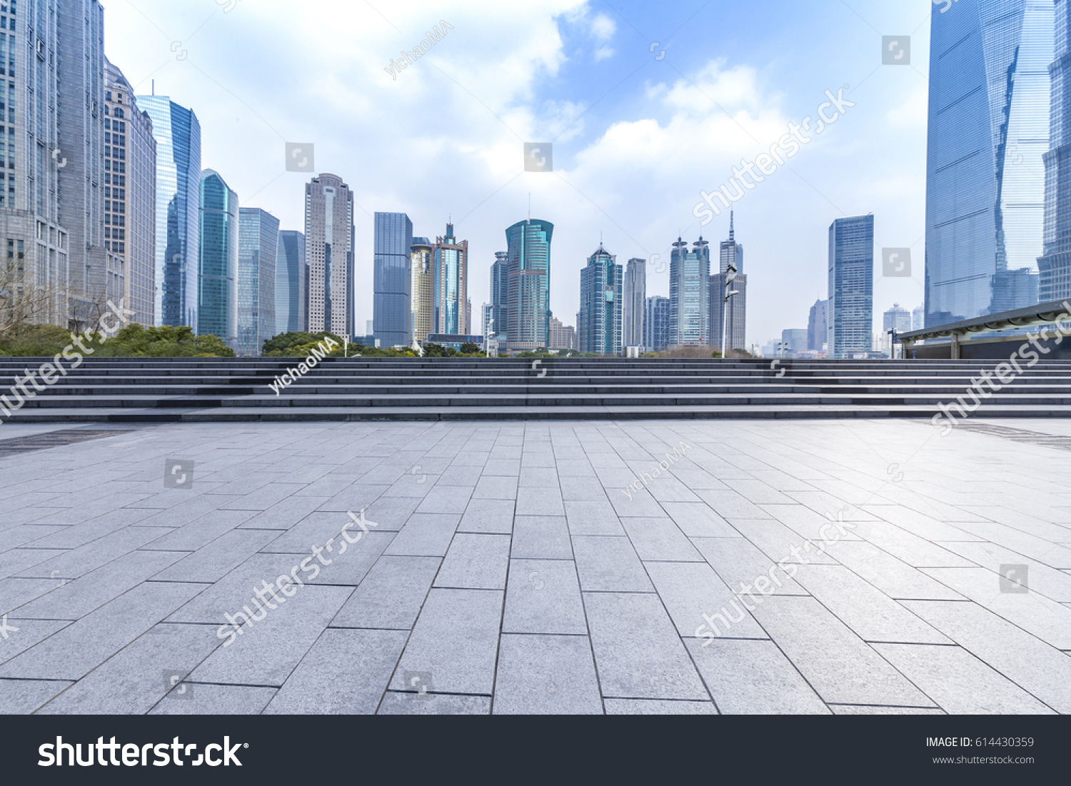 Panoramic skyline and buildings with empty concrete square floor #614430359