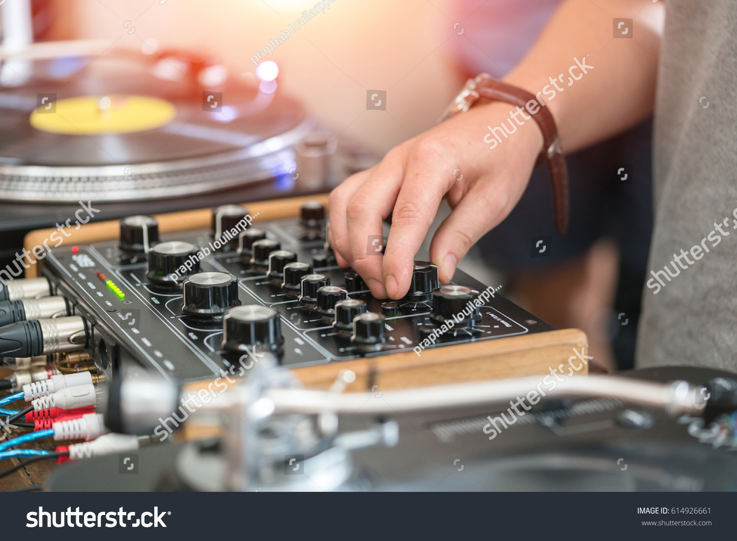 Dj play music at hip hop party.Turntable vinyl record player,analog sound technology for disc jockey to scratch vinyl records and mix tracks #614926661
