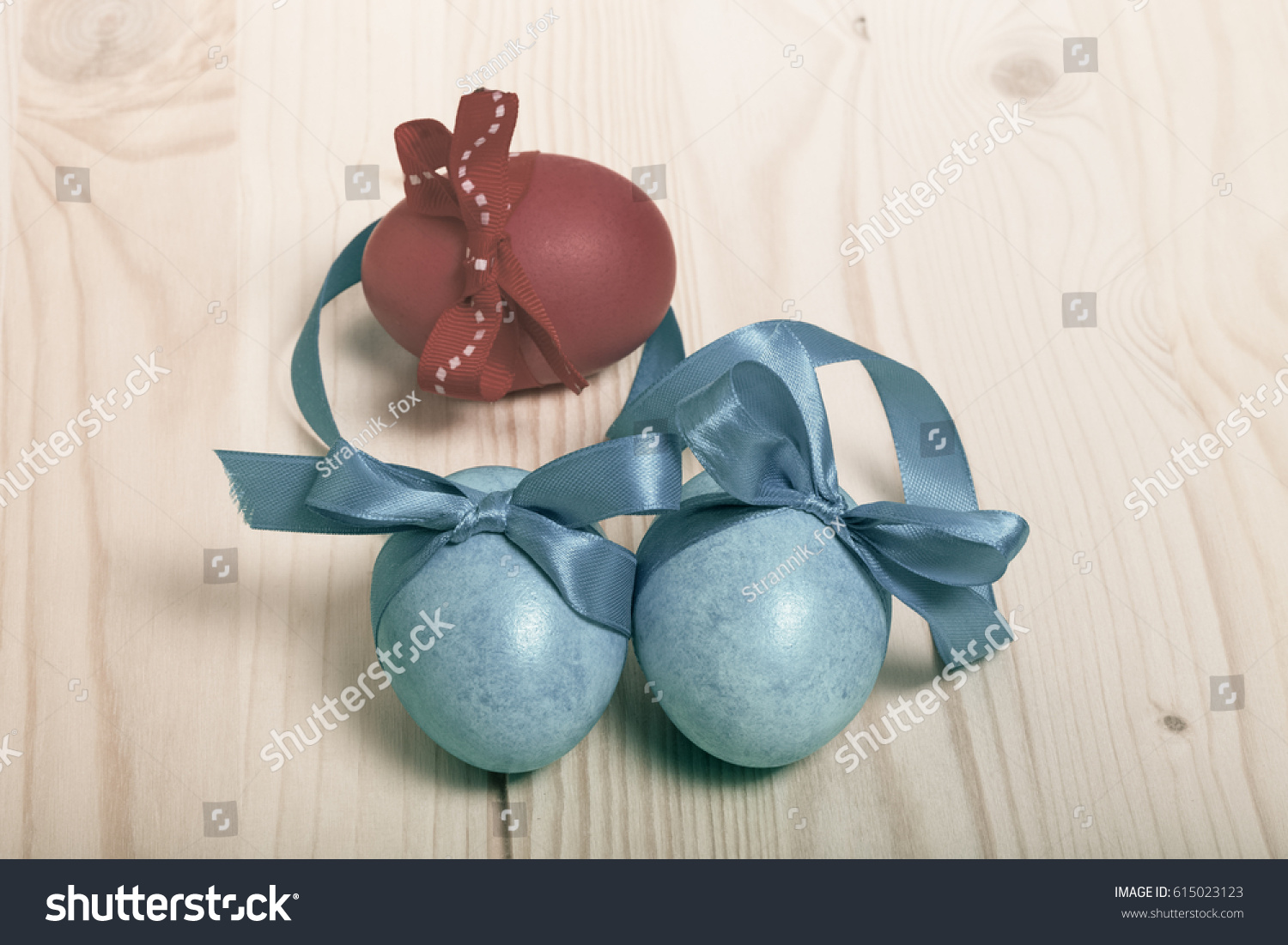 Easter composition on light wooden background. Toned. #615023123