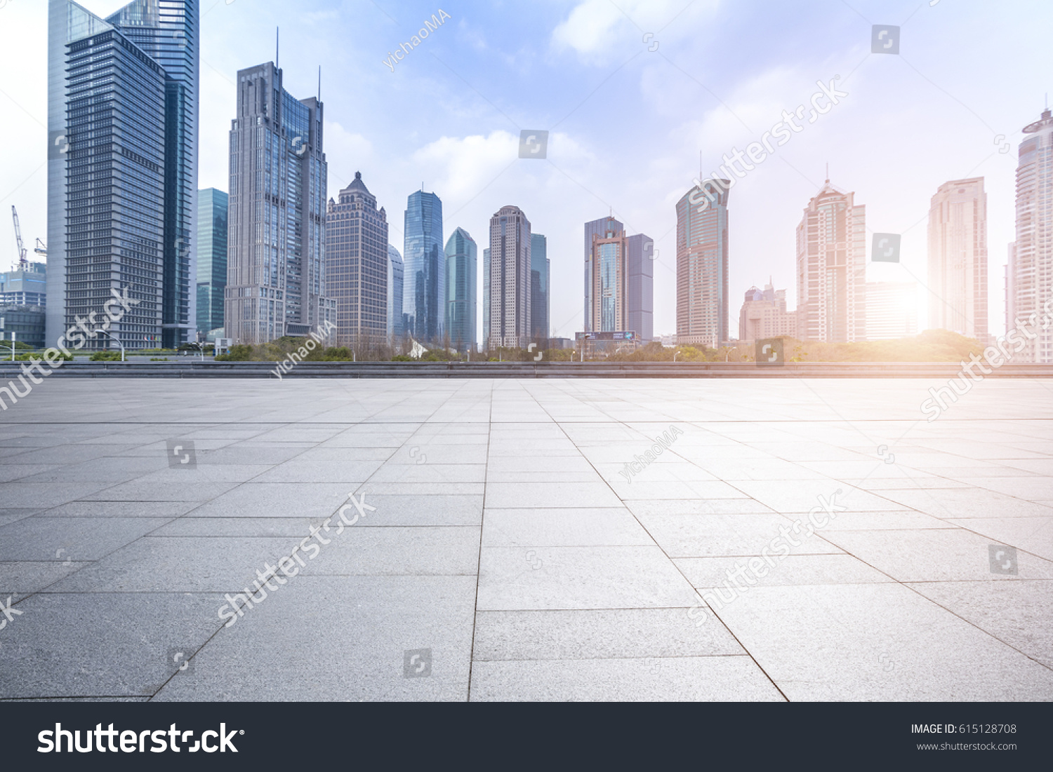 Panoramic skyline and buildings with empty concrete square floor #615128708