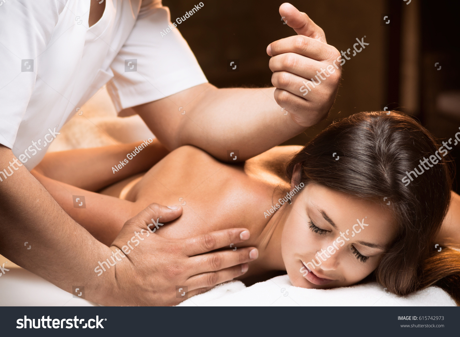 The girl enjoys deep tissue massage #615742973