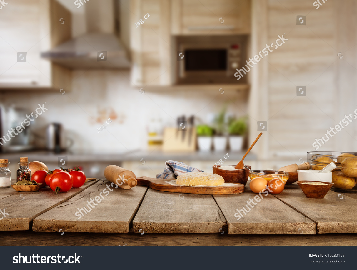 Baking ingredients placed on wooden table, ready for cooking. Copyspace for text. Concept of food preparation, kitchen on background. #616283198