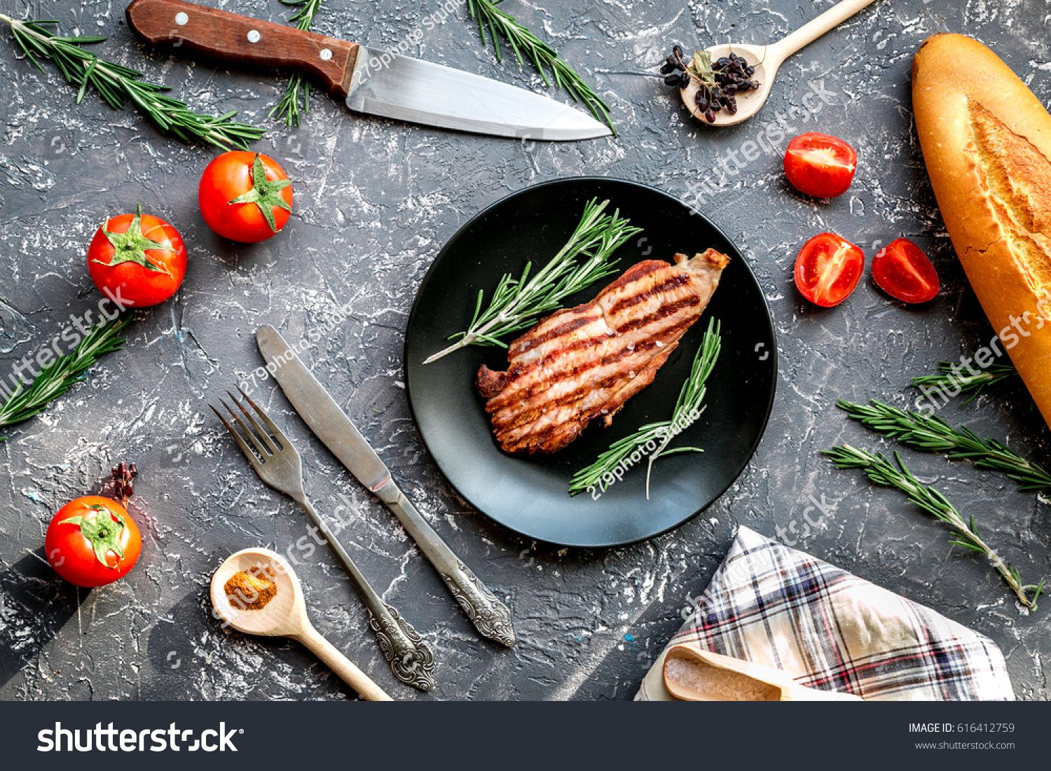 pork steak in home food concept on gray background top view #616412759