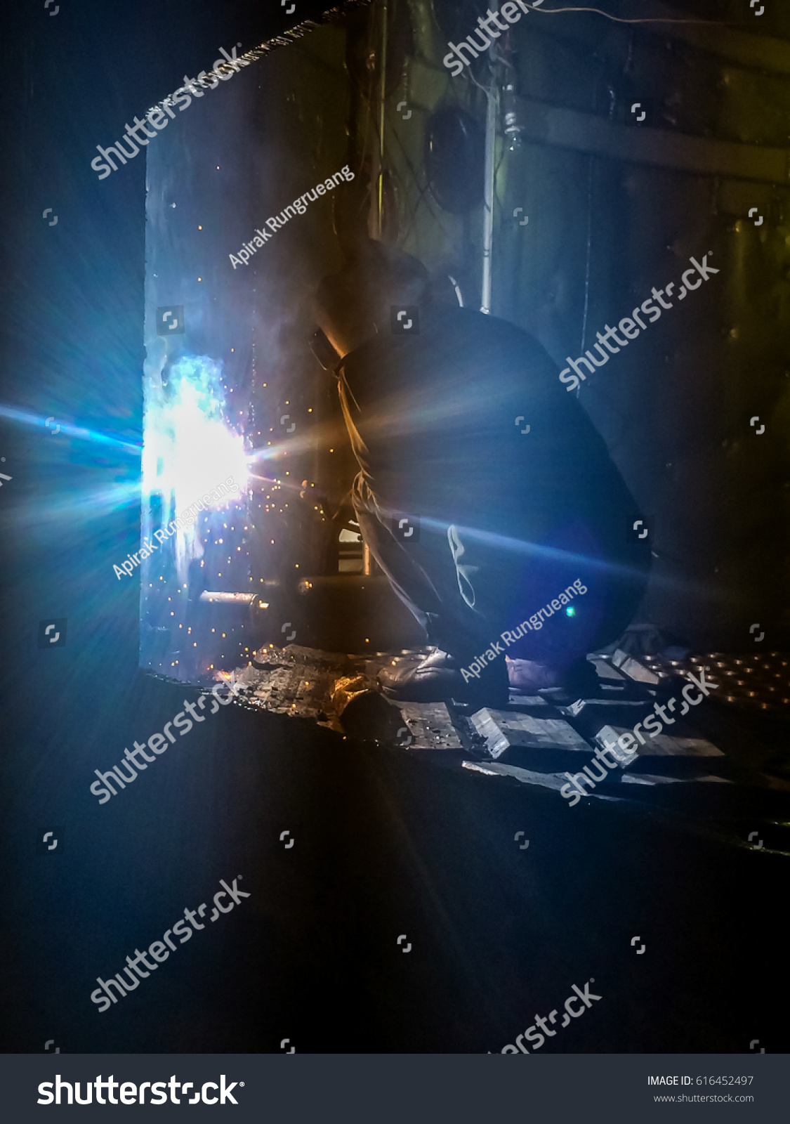 Light from worker is welding #616452497