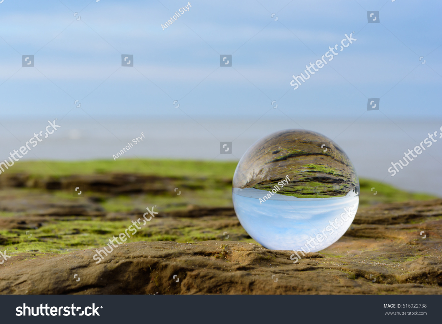 Seashore is reflected inside the crystal ball #616922738