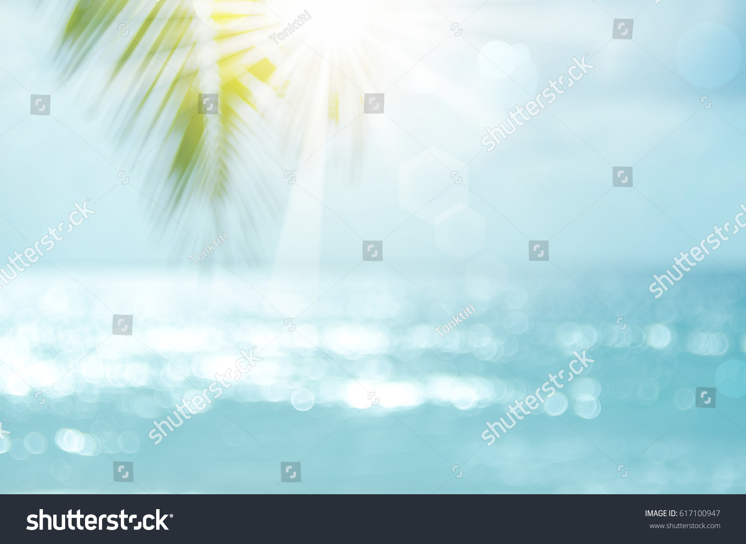 Blur beautiful nature green palm leaf on tropical beach with bokeh sun light wave abstract background. Copy space of summer vacation and business travel concept. Vintage tone filter effect color style #617100947