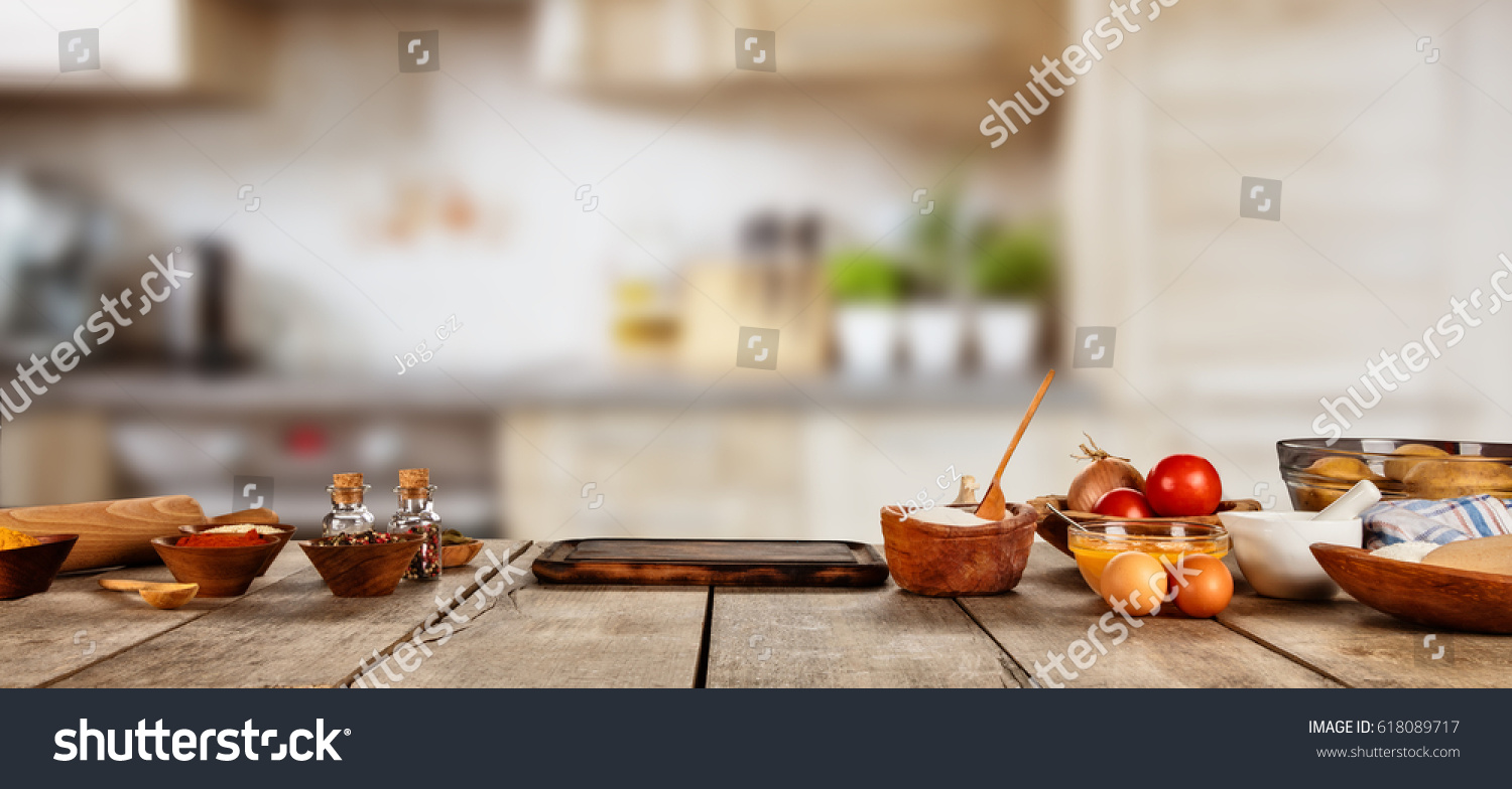 Baking ingredients placed on wooden table, ready for cooking. Copyspace for text. Concept of food preparation, kitchen on background. #618089717