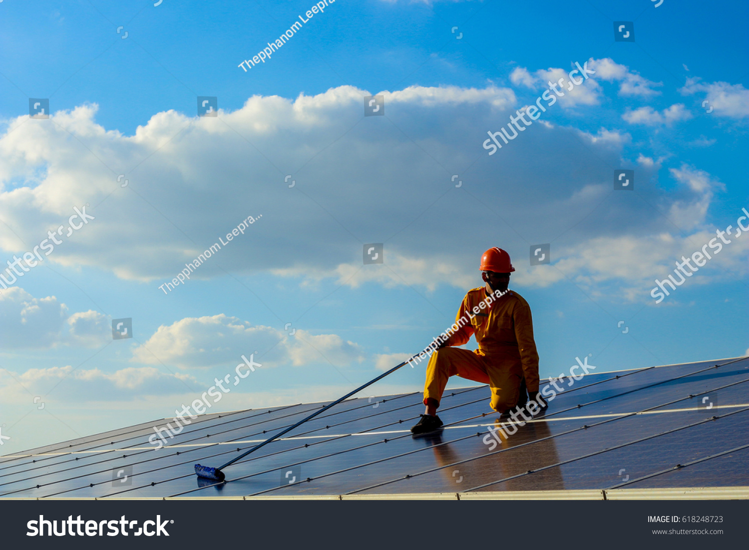 Engineers cleaning  the  solar power panel.  #618248723