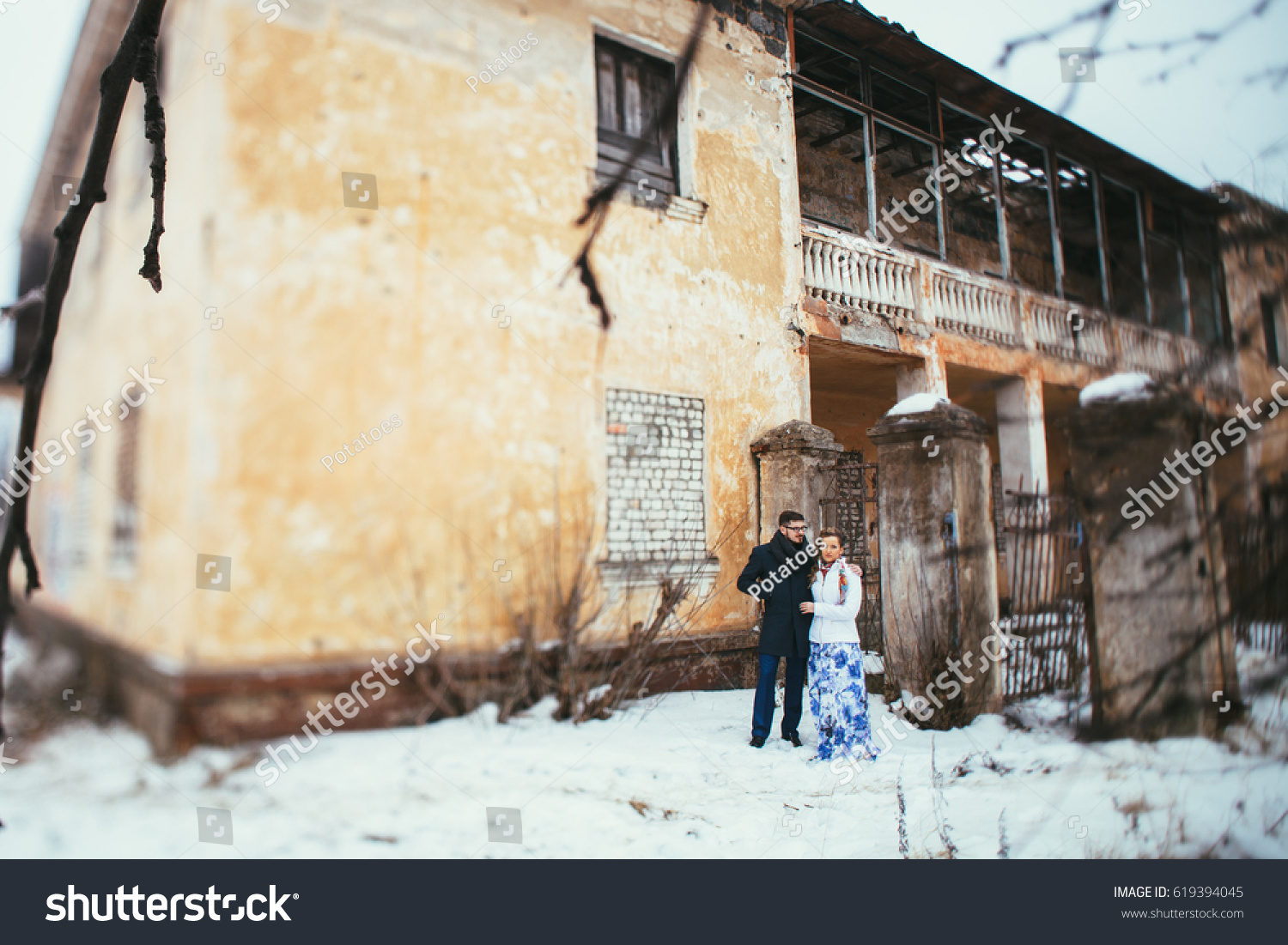 Winter wedding. Beautiful young couple in the old #619394045