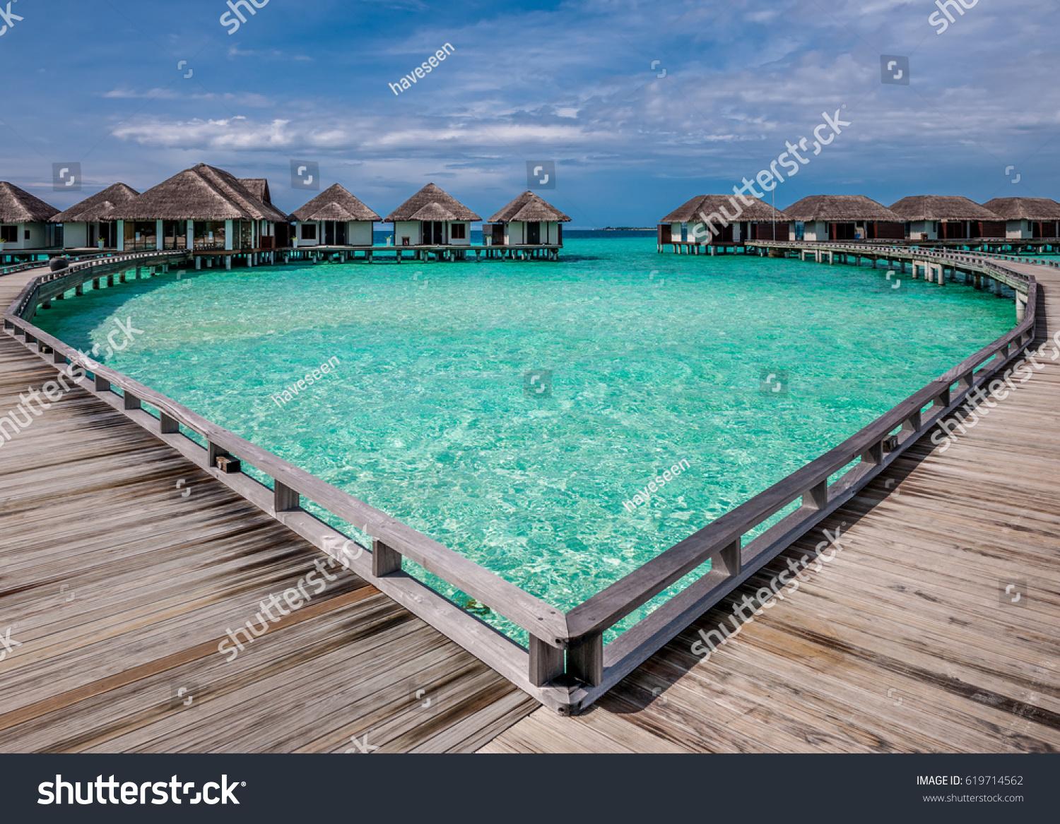 Beautiful beach with water bungalows at Maldives #619714562
