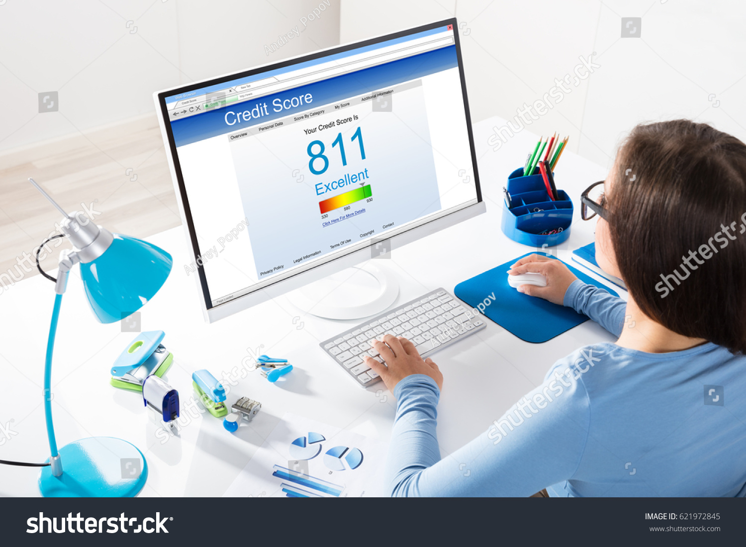 Close-up Of A Businesswoman Checking Credit Score On Computer At Workplace #621972845