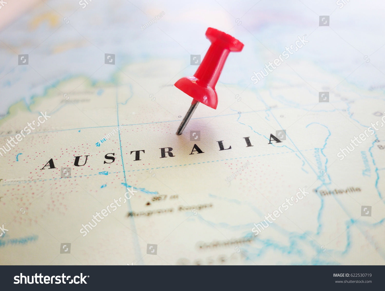 Closeup of an Australia map with red thumb tack                                #622530719
