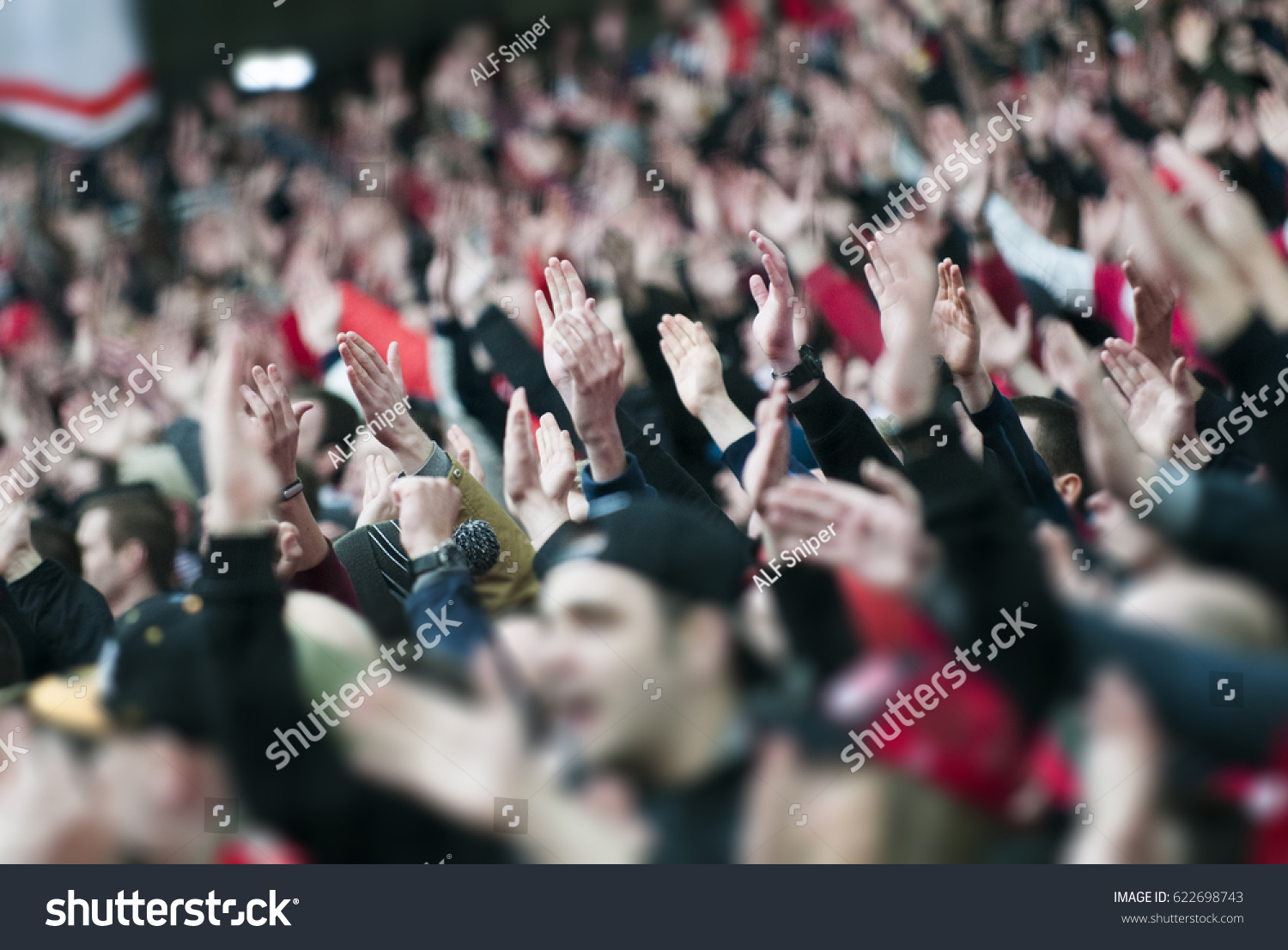 Football fans clapping on the podium of the stadium #622698743