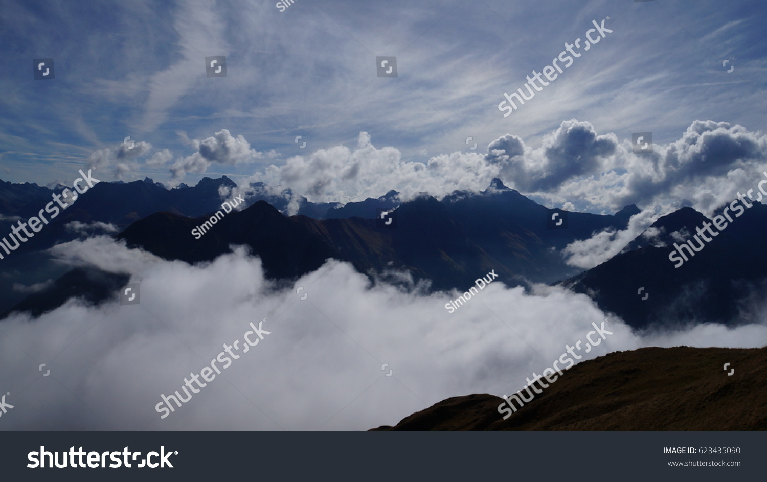Awesome cloudscape beneath on the mountains in the valley of Lech in Austria #623435090