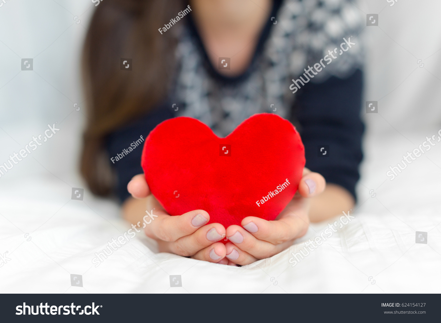 Heart in hands #624154127