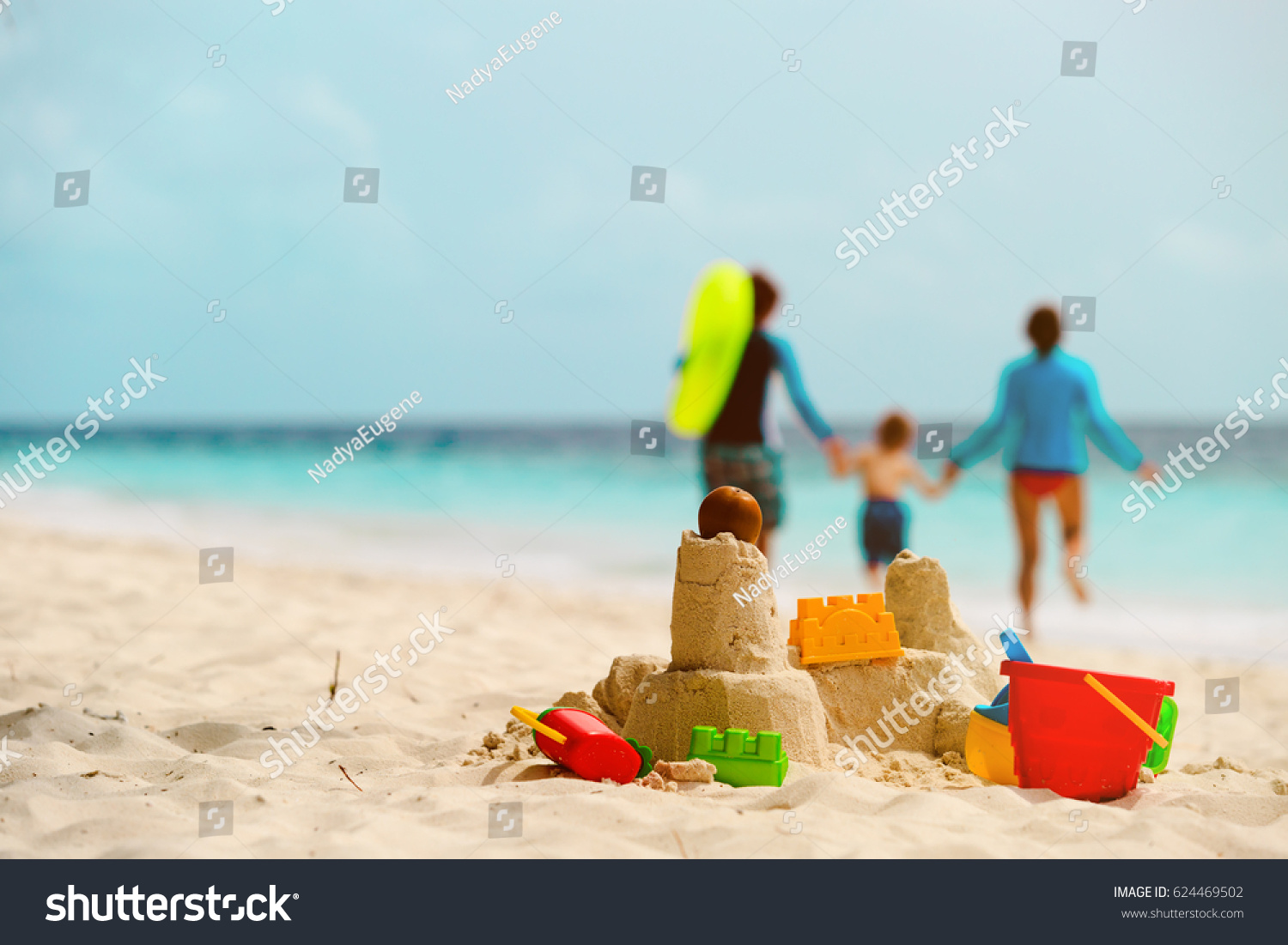 sand castle on tropical beach, family vacation #624469502
