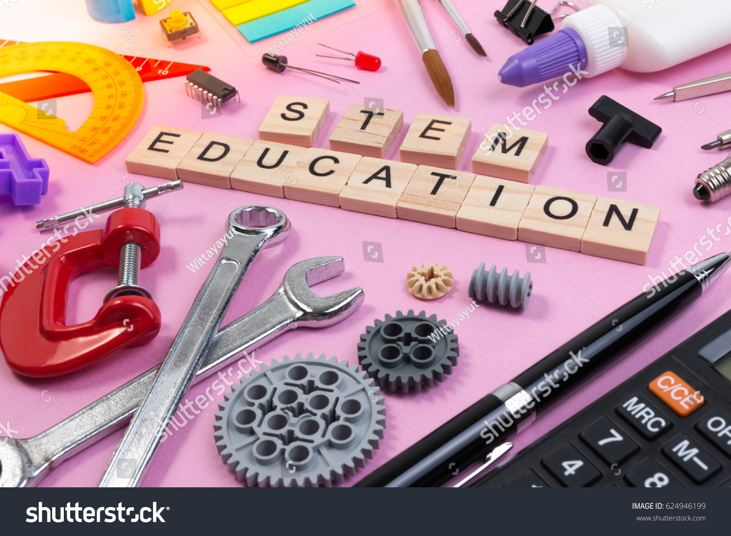 School equipment with word STEM Education over pink background in education STEM concept. School desk with stationery tools for STEM learning. #624946199