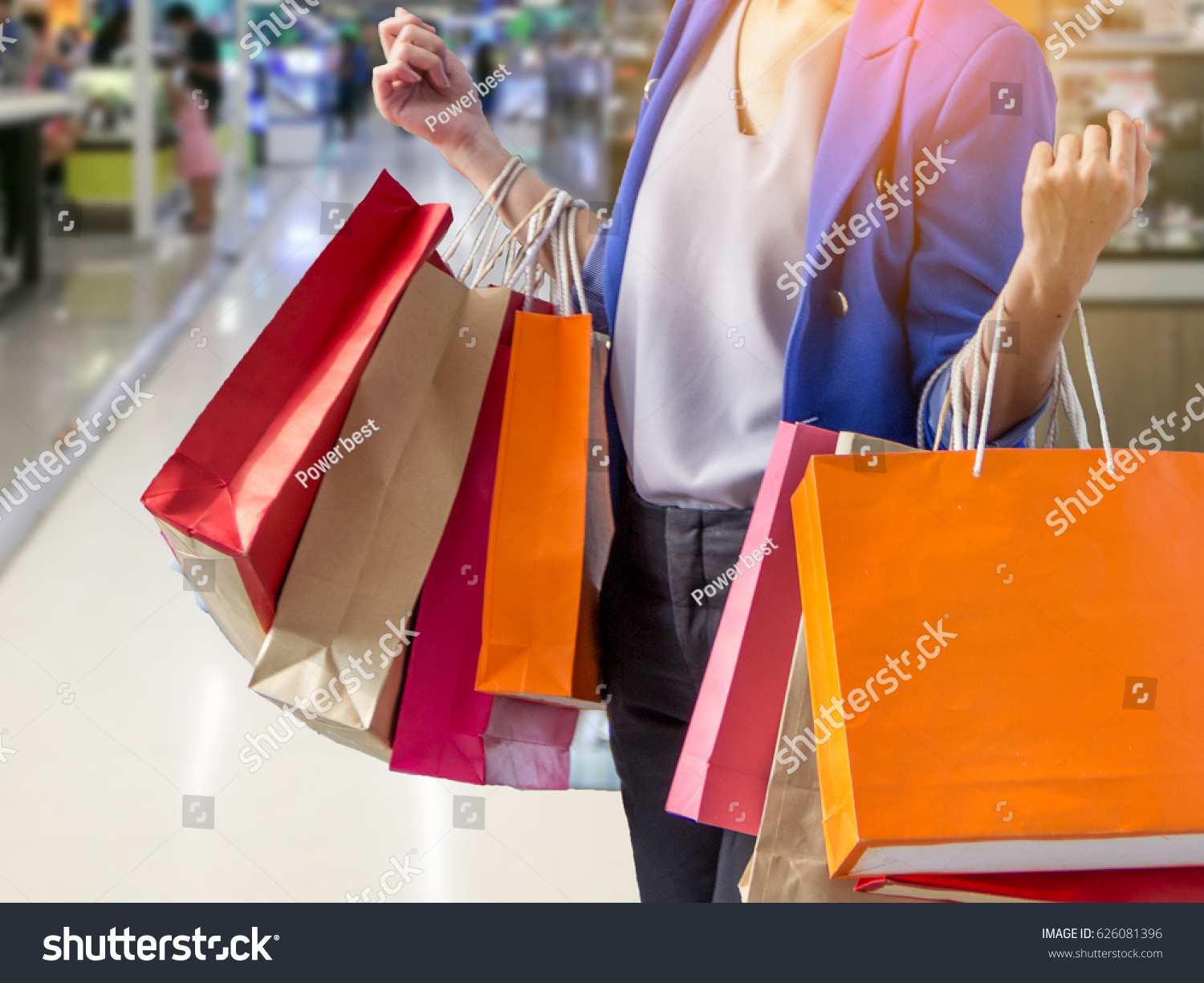 woman holding shopping bag in mall
 #626081396