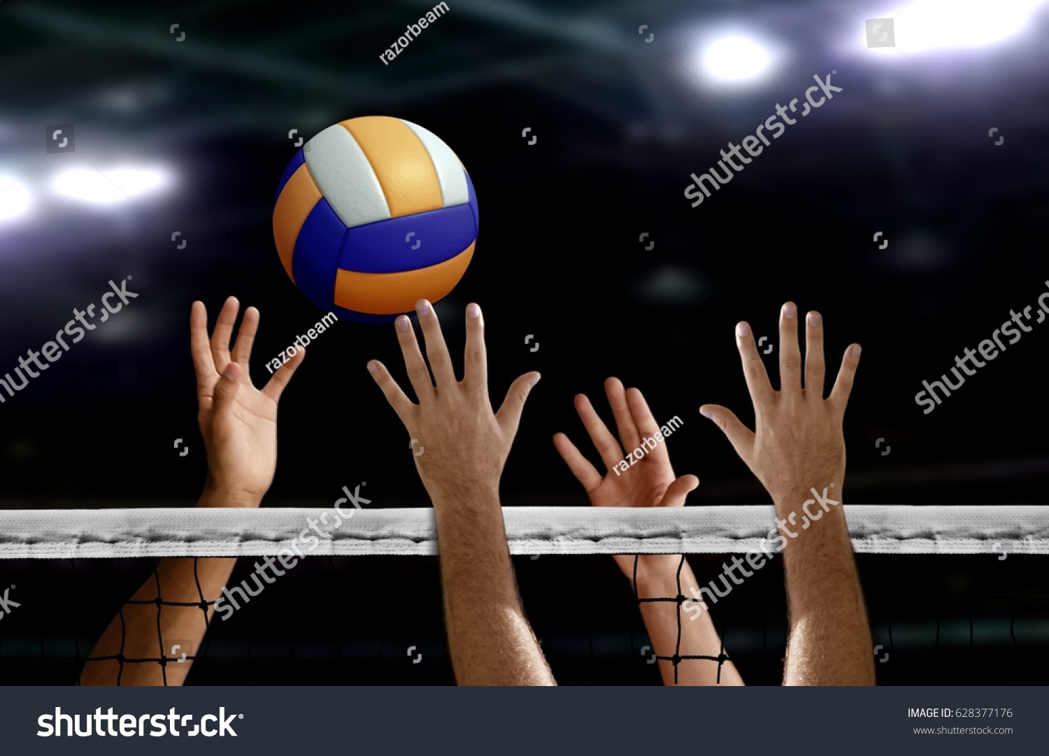 Volleyball spike hand block over the net #628377176