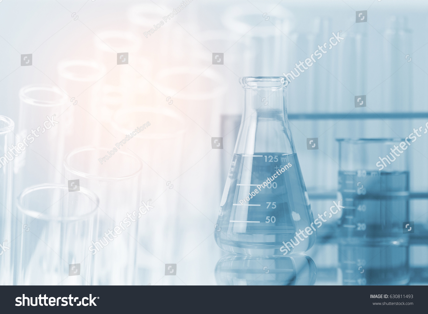 Double exposure of equipment and science experiments ,Laboratory glassware containing chemical liquid, science research,science background and science concept. #630811493