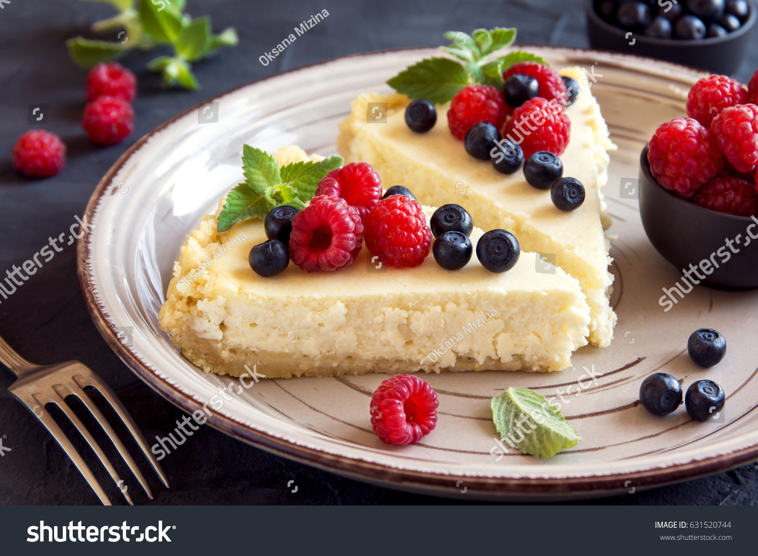 Homemade cheesecake with fresh berries and mint for dessert - healthy organic summer dessert pie cheesecake. Cheese cake. #631520744