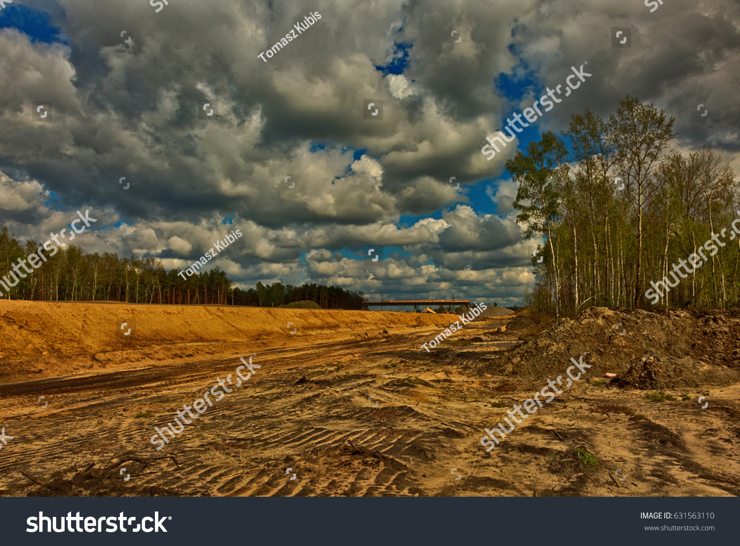 A view from above for the construction of a highway leading through the forest.Poland in april.Photography in HDR technique using special filters. Horizontal view. #631563110