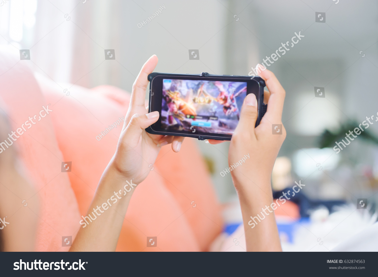 young girl playing games on line in home  #632874563
