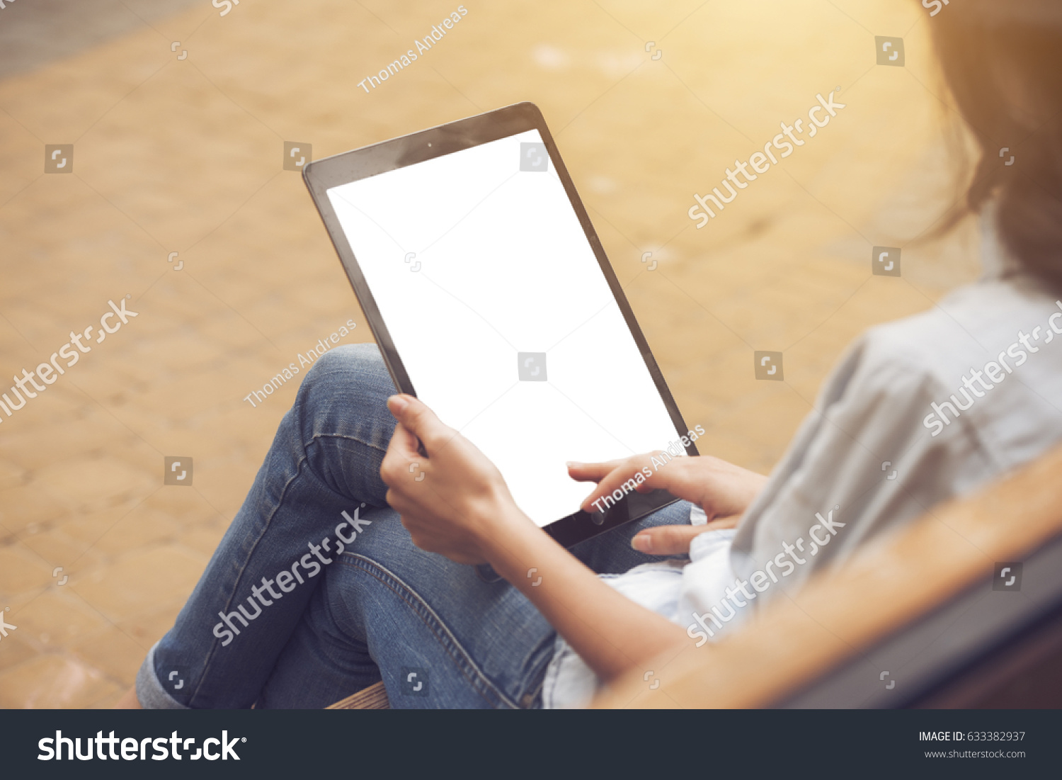 close up on a white blank screen tablet pc in female hands, mockup #633382937