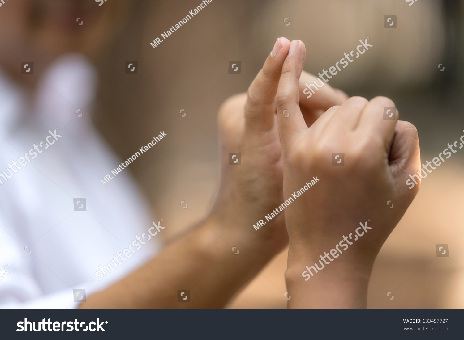Linking little fingers with somebody to confirm promise.Hands posing together concept. #633457727