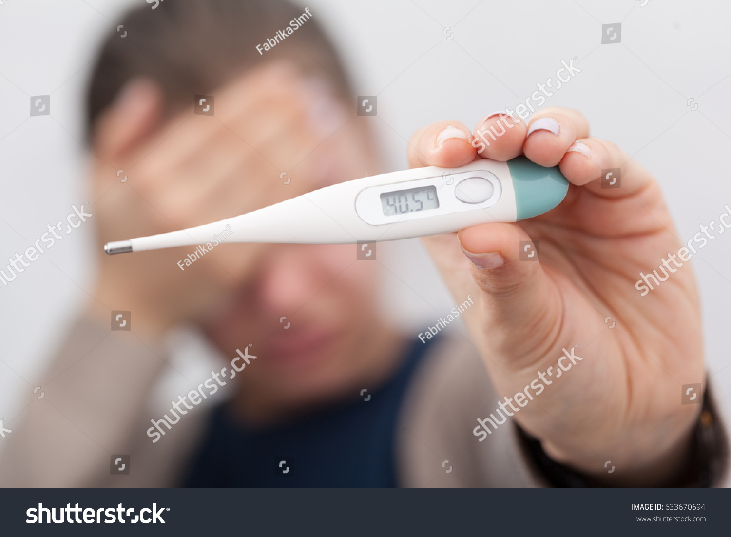 Sick women with a thermometer #633670694
