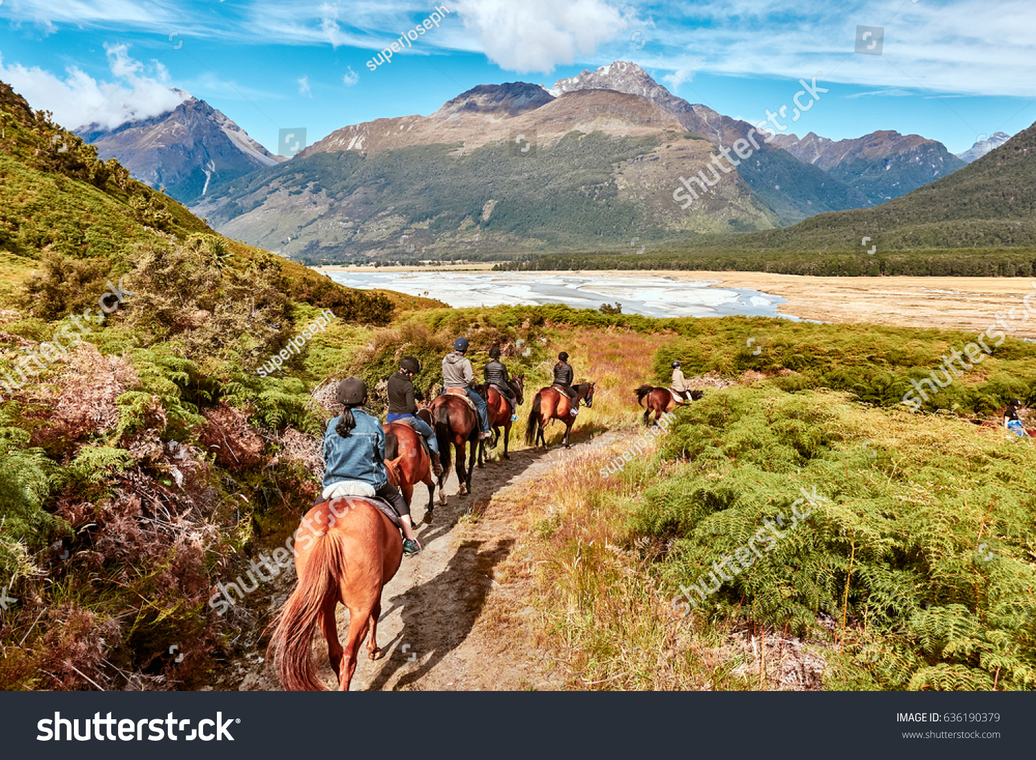 Glenorchy, New Zealand - Feb 07, 2017: Tourist embark on a Horse Riding on a farm in Glenorchy, NZ. it was used as one of the settings in Lord of the Rings films.                                #636190379