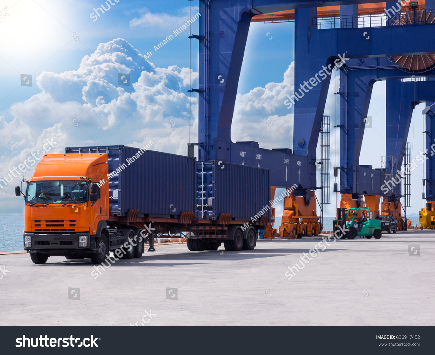 Container discharging from the vessel at the port move to container yard by truck #636917452