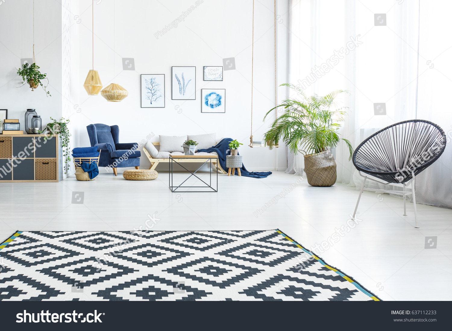 Modern living room with sofa, round chair and pattern carpet #637112233