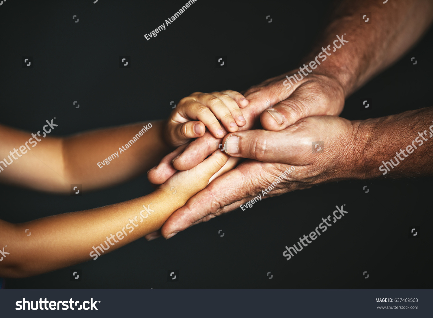 The concept of generations. Hand of a child and an elderly person #637469563