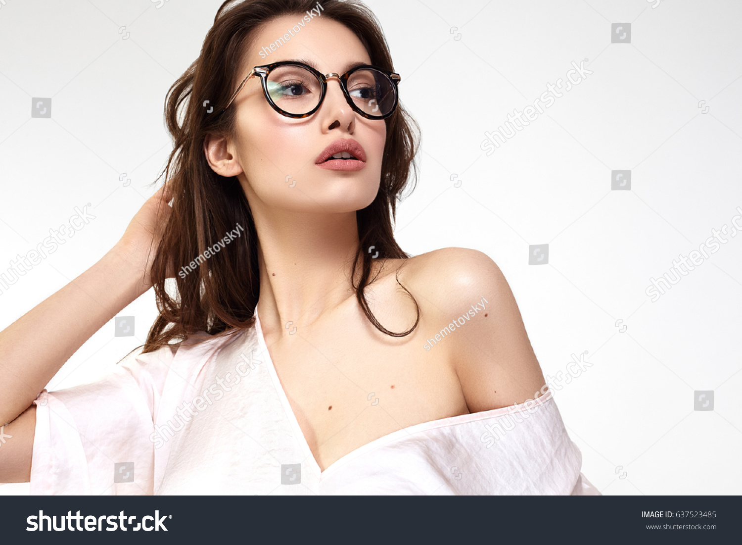 Female Eye wear. Attractive Brunette Girl With Natural Face Makeup In Transparent Glasses Frame. #637523485
