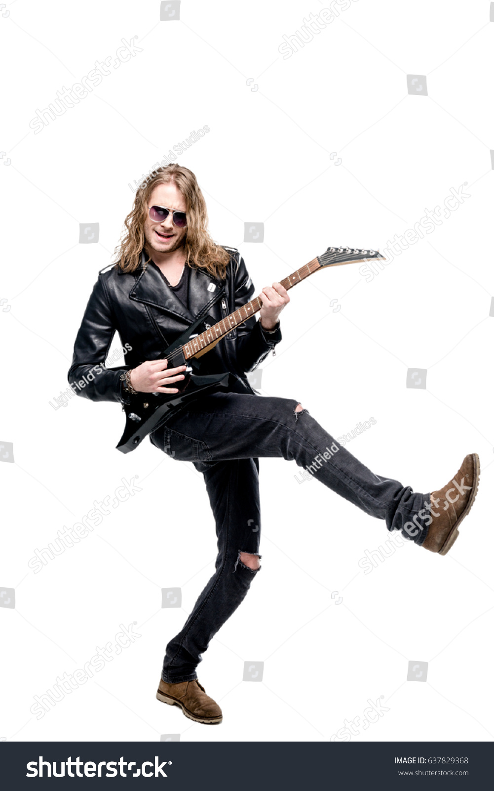 handsome rocker in sunglasses posing playing electric guitar isolated on white, rock star guitar concept #637829368